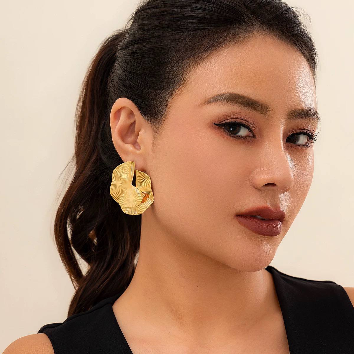 Distinct ruffled or petal-shaped design earring