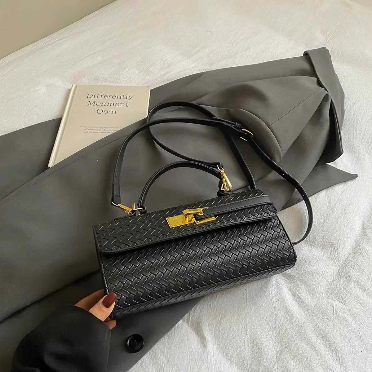 Black woven synthetic leather handbag