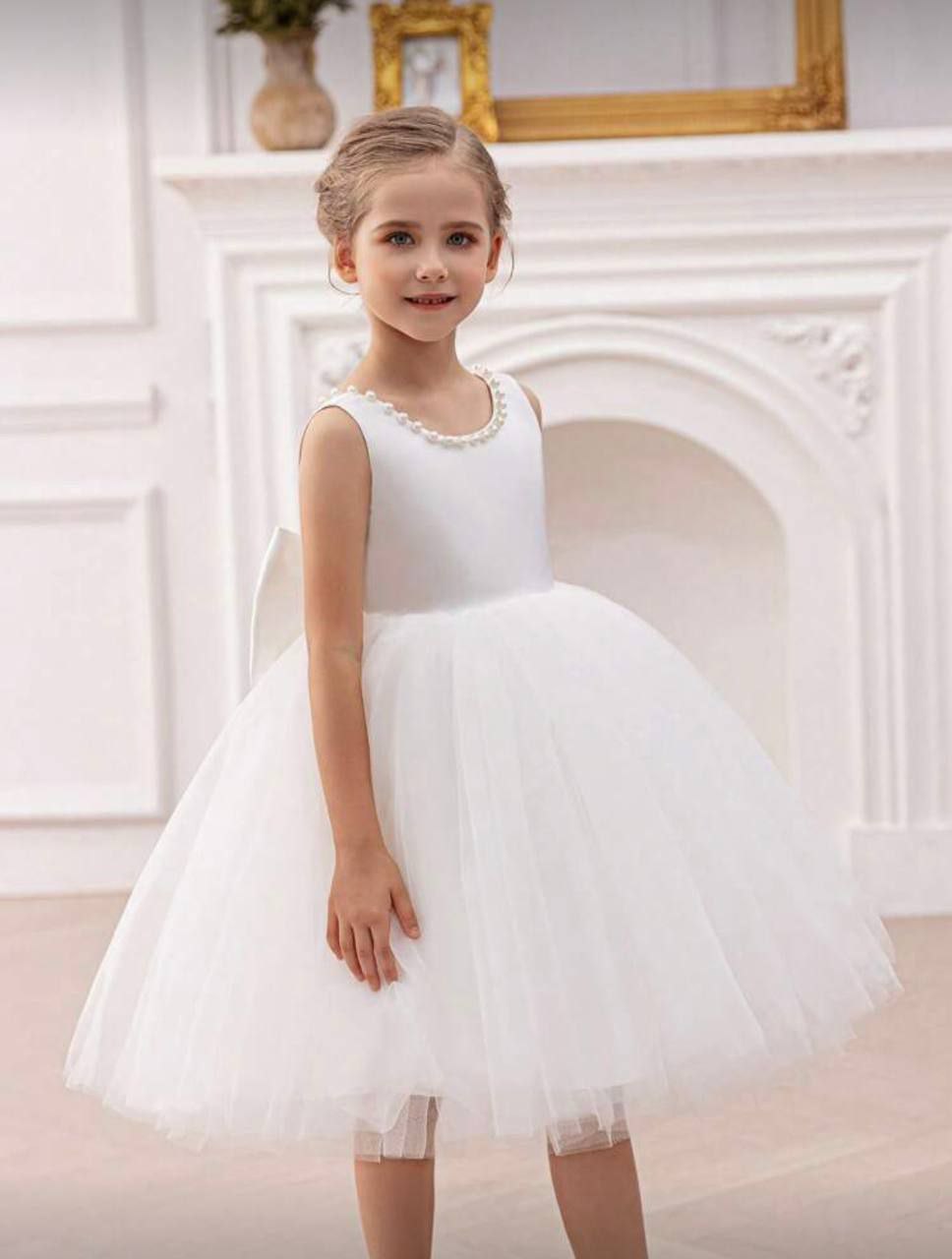 White, sleeveless special occasion dress