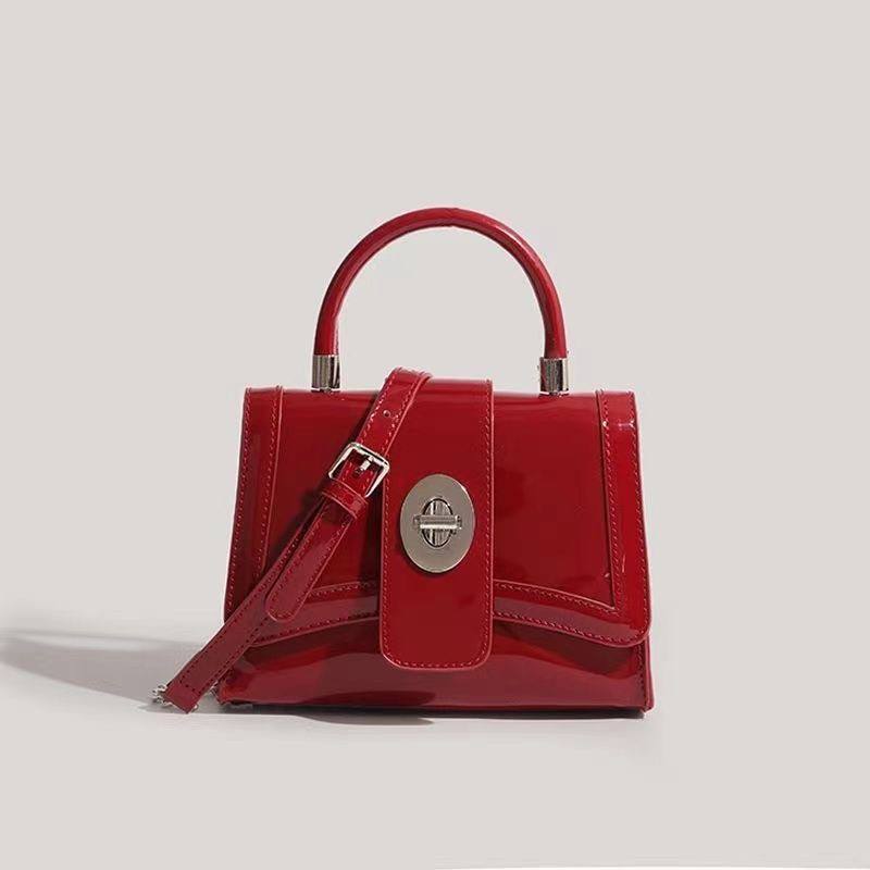 Red patent leather top-handle crossbody bag