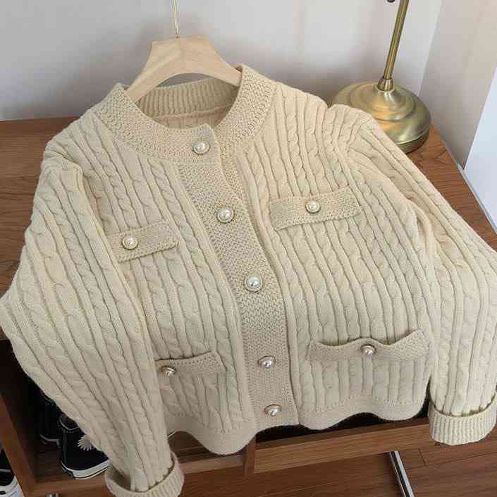 Cream colored cable knit cardigan