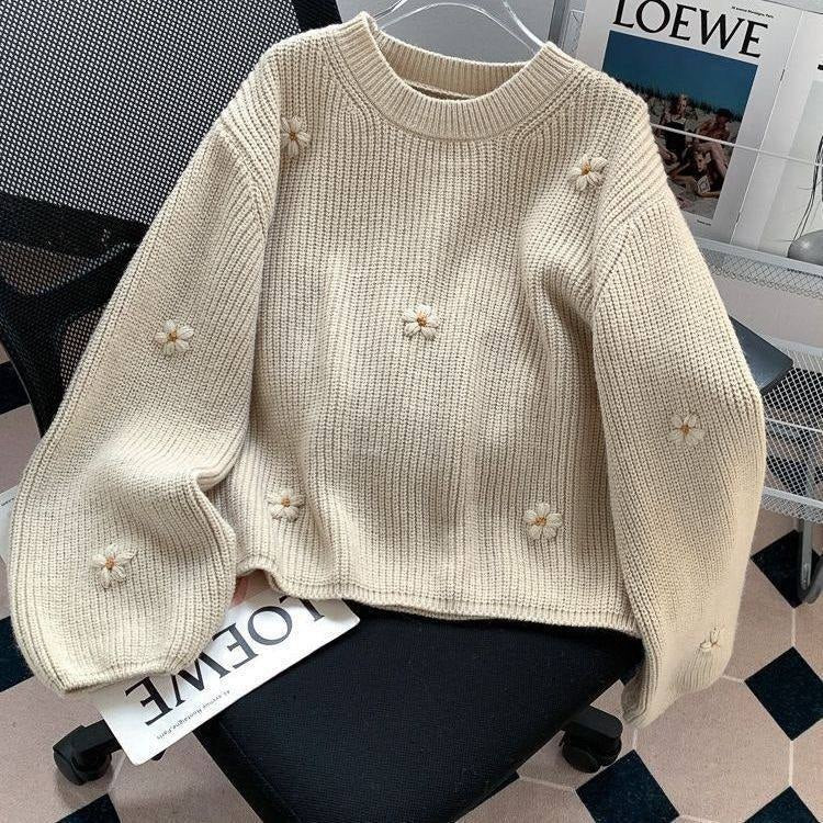 Cream colored chunky ribbed-knit crewneck sweater