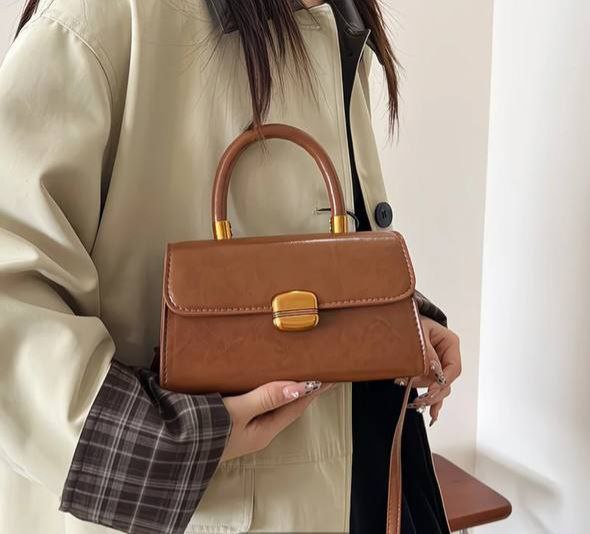 Brown, structured top-handle handbag
