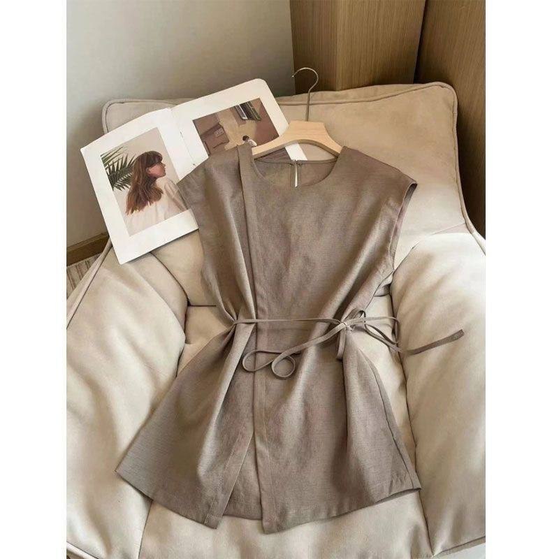 Minimalist sleeveless wrap blouse
