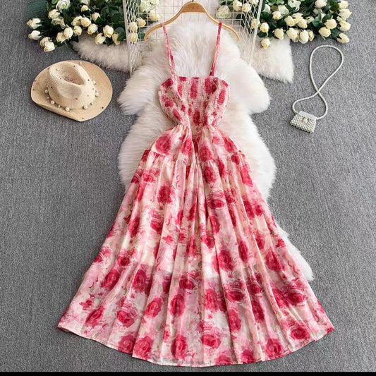 Sleeveless maxi dress with a pink and red floral print