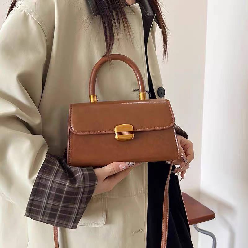 Small brown top-handle satchel or shoulder bag