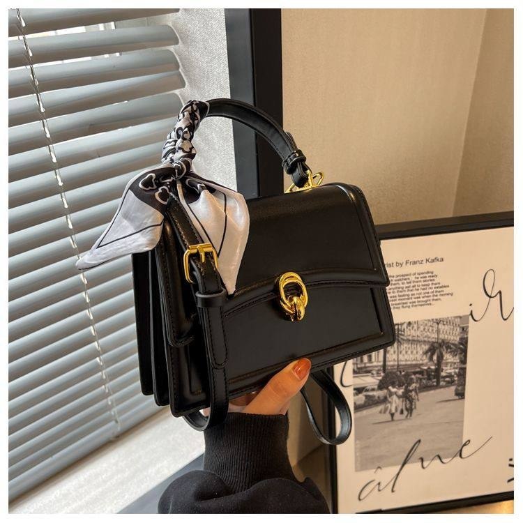 Black structured flap square crossbody bag