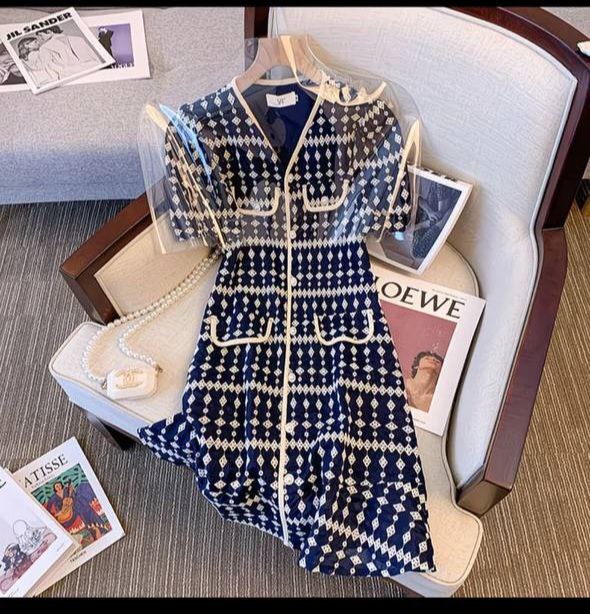 Navy blue and white patterned V-neck mini dress