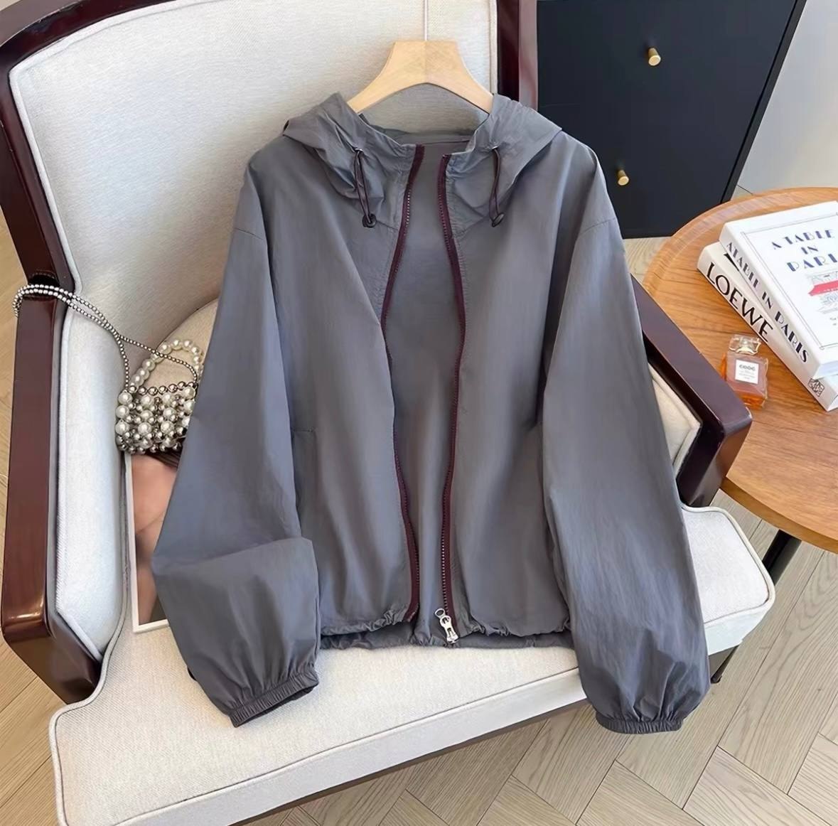 Gray lightweight hooded windbreaker jacket