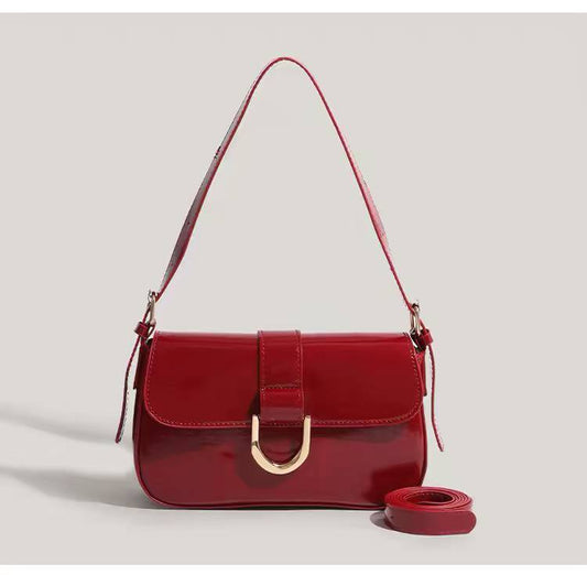 Glossy red shoulder bag,