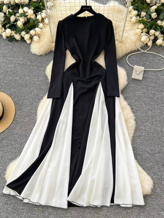 Long sleeve maxi dress with a black and white color block design