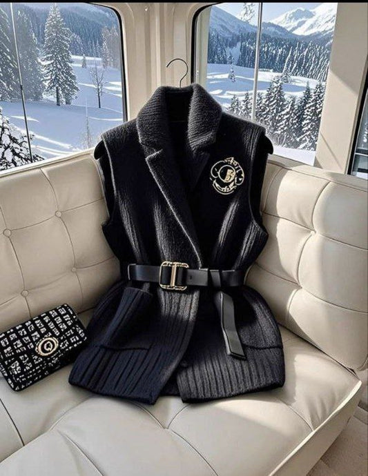 Black knitted vest with a belt and brooch