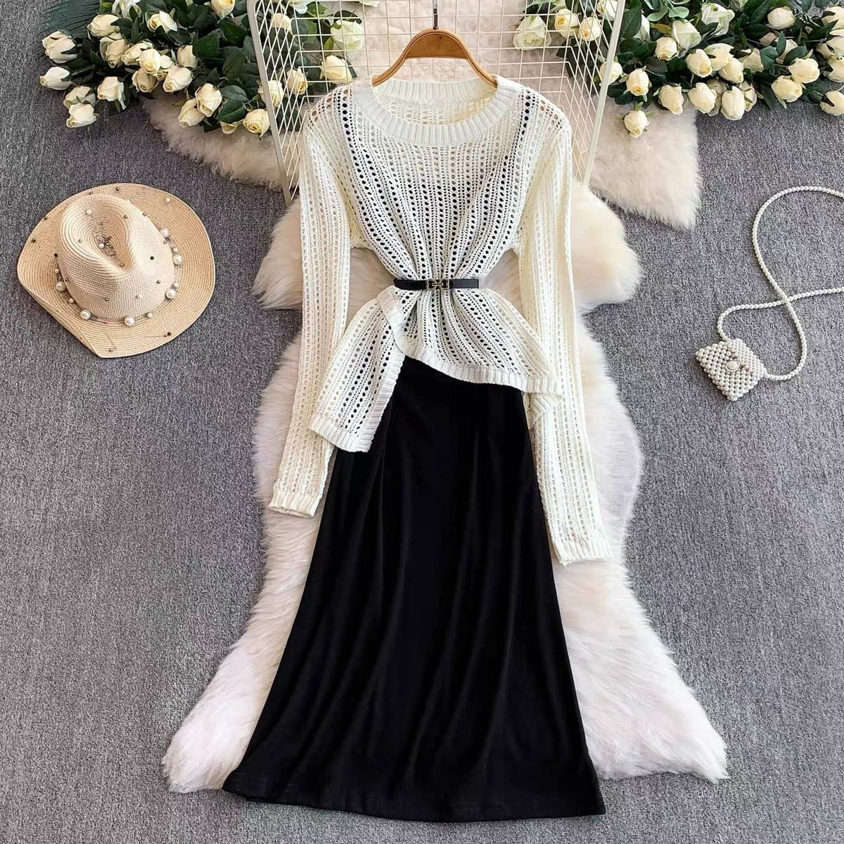 Asymmetrical open knit mesh crochet sweater paired with a long black midi to maxi skirt