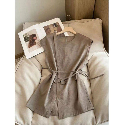 khaki/taupe cap sleeve wrap blouse featuring a tie-waist drawstring