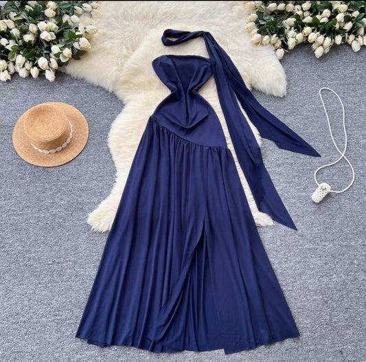 Navy blue halter neck maxi dress with an asymmetrical front slit