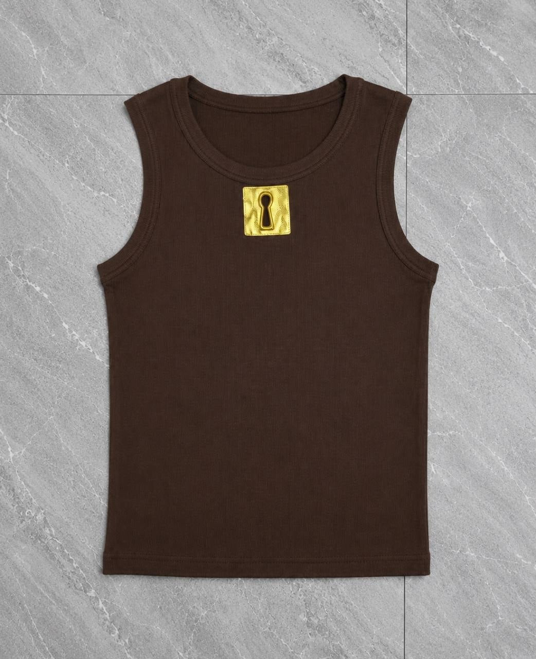 Ribbed knit tank top featuring a prominent gold metallic keyhole patch