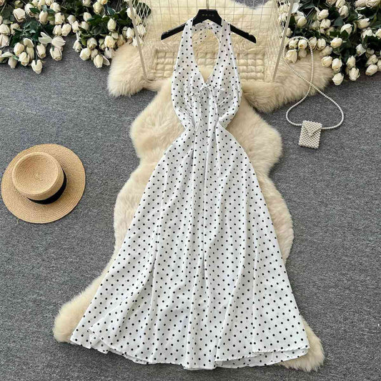 Classic white halter midi dress decorated with black polka dots