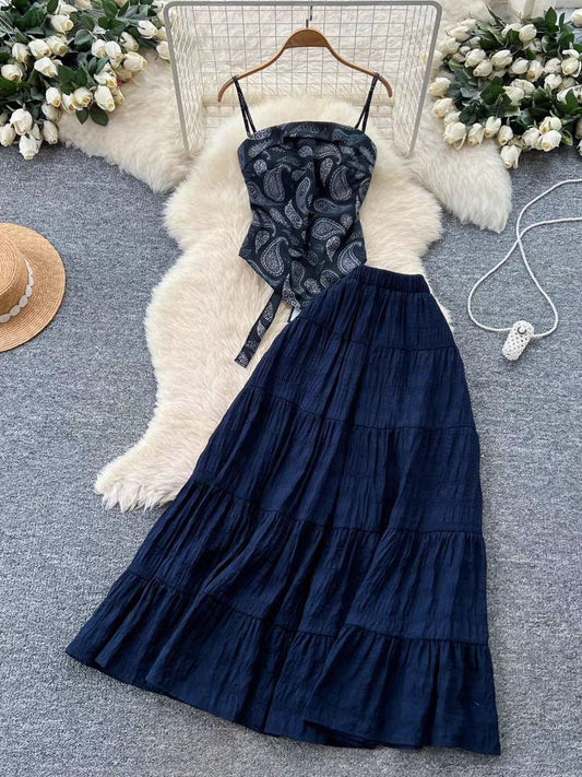 Paisley-print camisole top paired with a navy blue tiered maxi skirt
