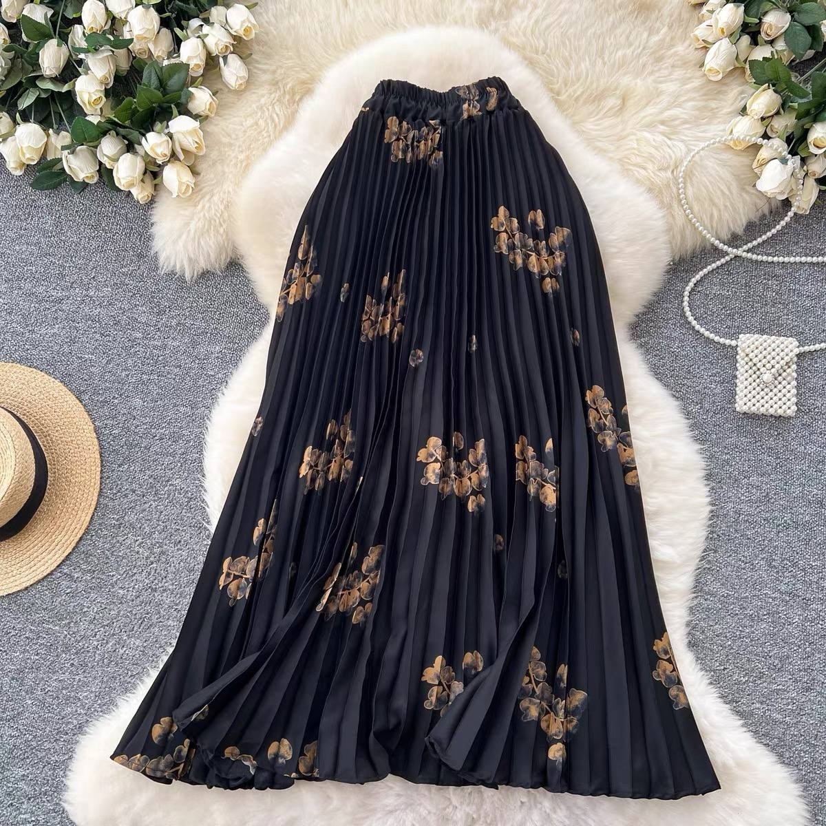 High waisted A-line pleated midi skirt in a distinct black and brown floral pattern
