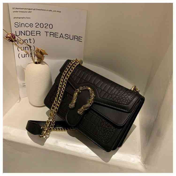 Crocodile-embossed faux leather crossbody bag