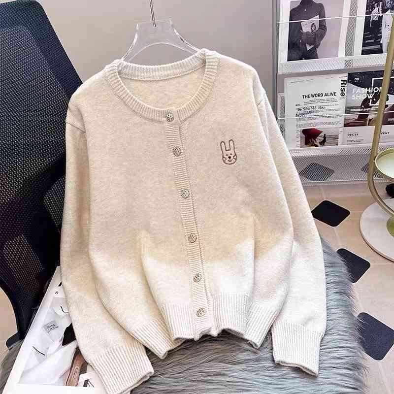 Cream-colored knit cardigan