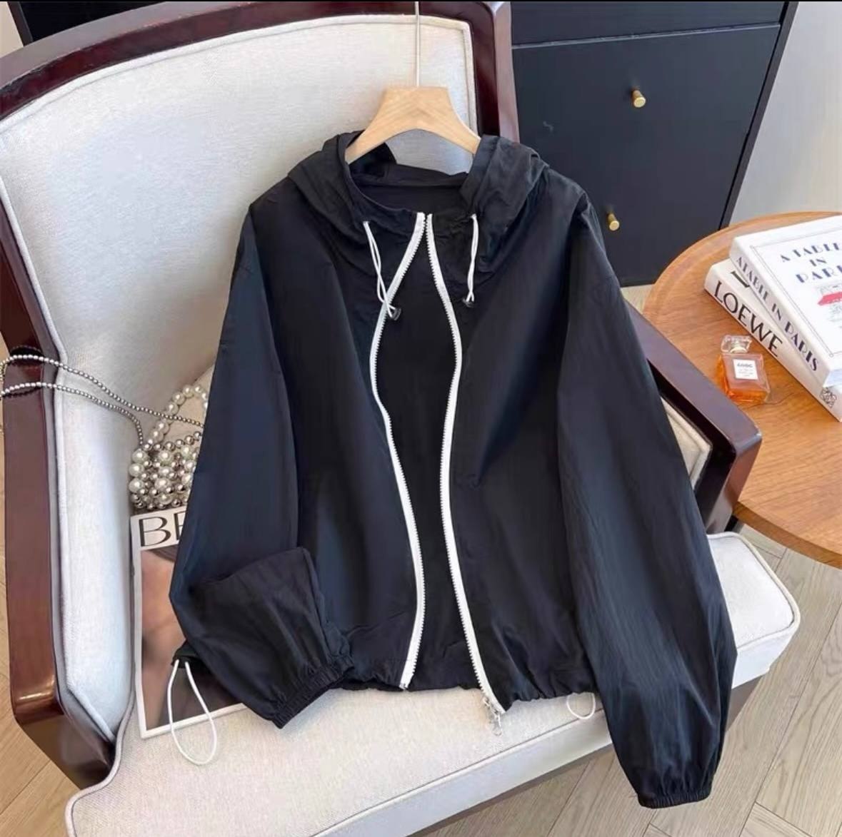 Black lightweight hooded windbreaker jacket