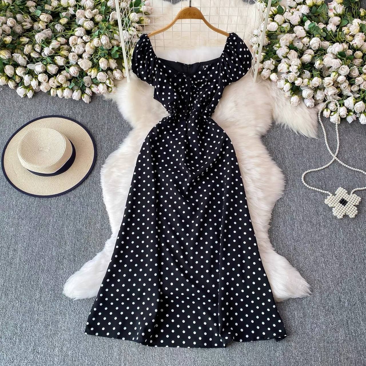 Black milkmaid-style midi dress with white polka dots