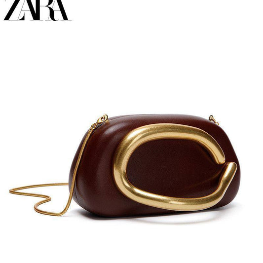 Zara clutch bag with a C-shaped gold metal handle