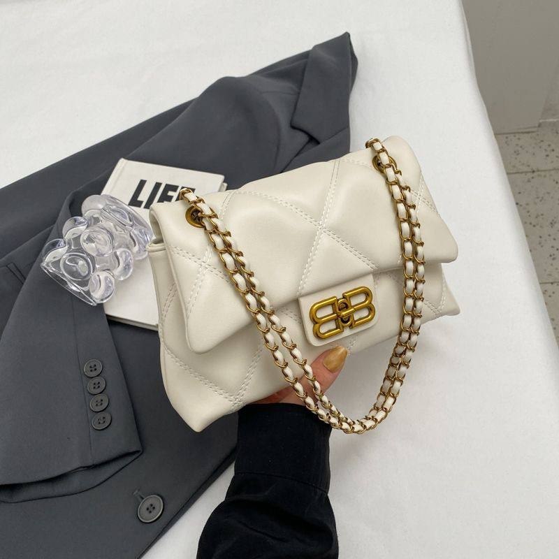Cream-colored quilted faux-leather flap crossbody shoulder bag