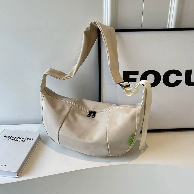 Crescent-shaped shoulder bag
