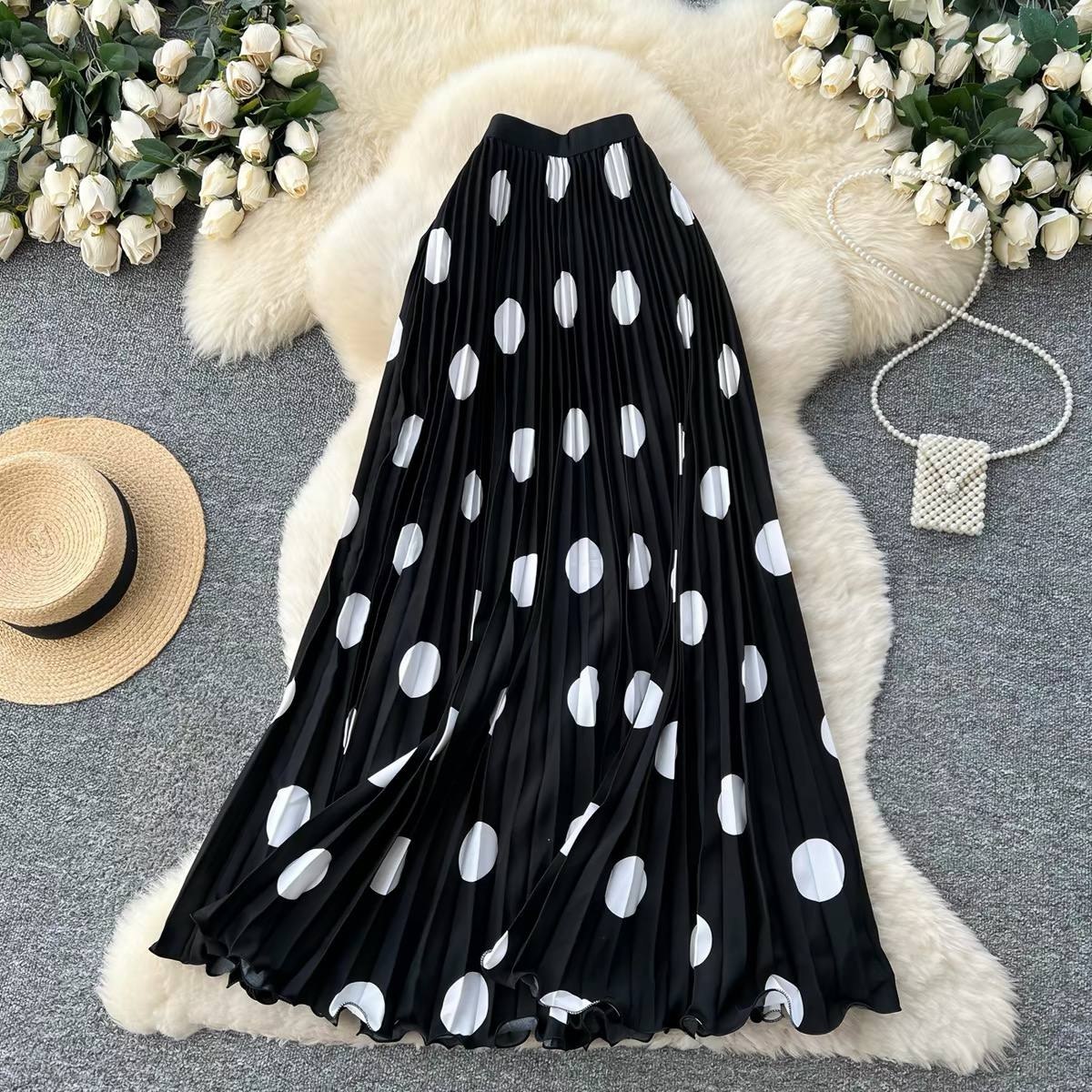 High-waisted pleated polka dot maxi skir