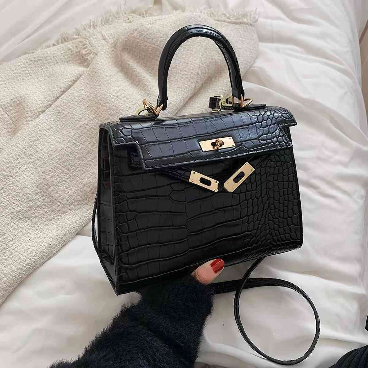 Nlack crocodile embossed top handle bag