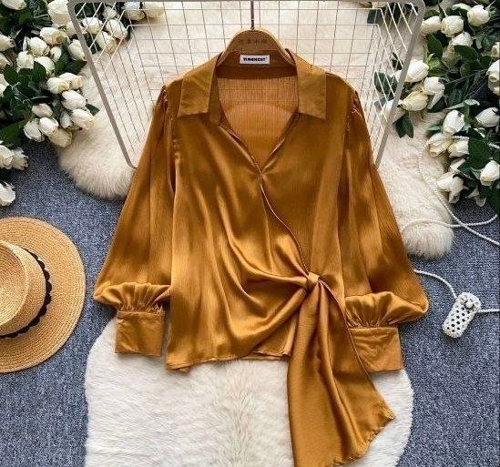 Mustard yellow satin wrap-style long-sleeve blouse featuring a collared V-neck