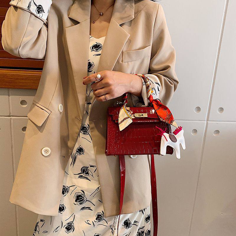 Red crocodile-embossed top handle bag