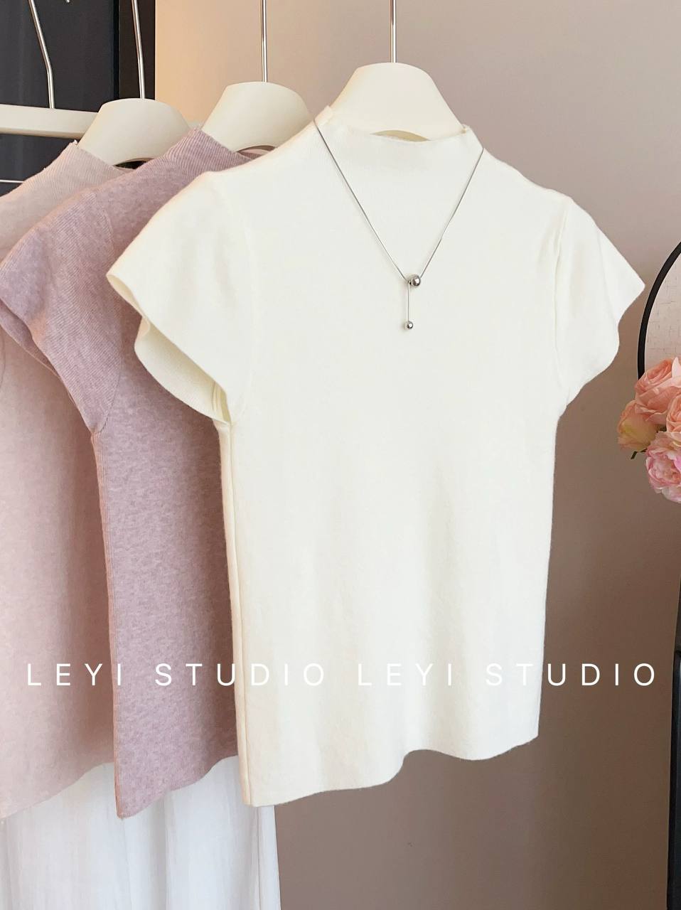 White short-sleeve knit top