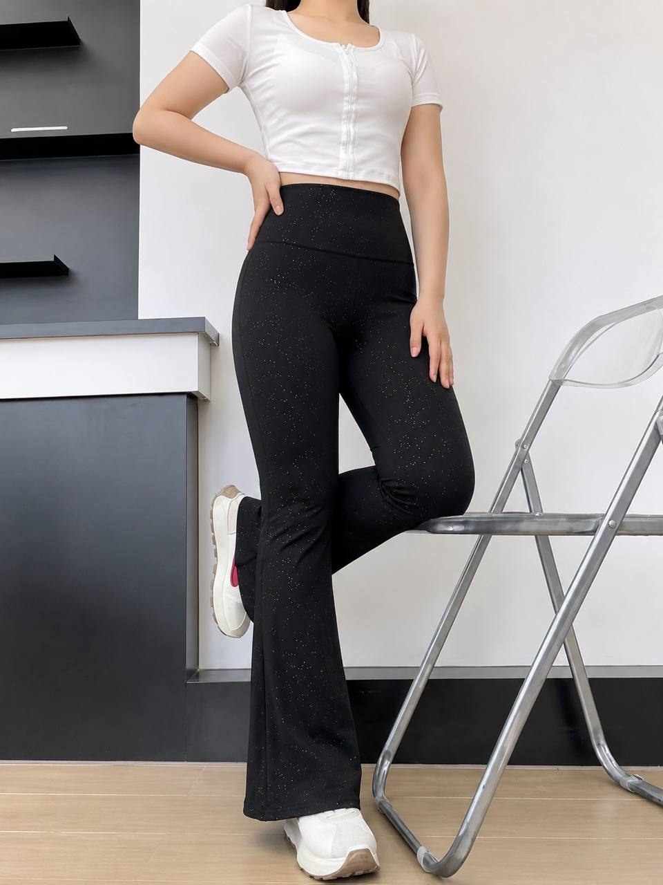 High-waisted black glitter flare pants