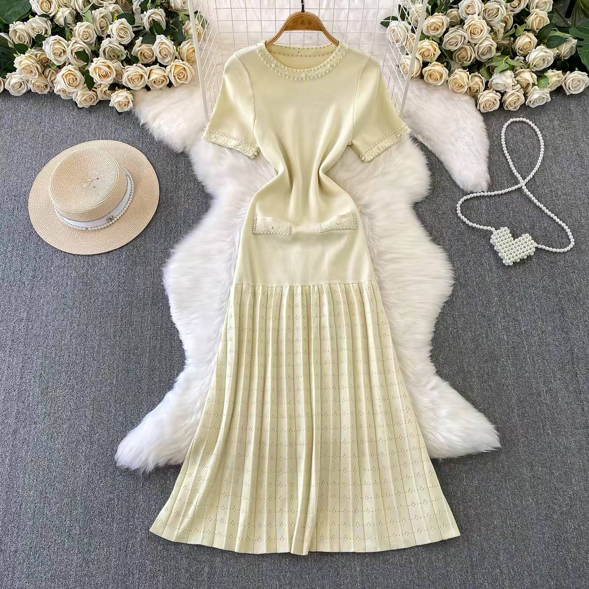 Cream pleated knit maxi dress.