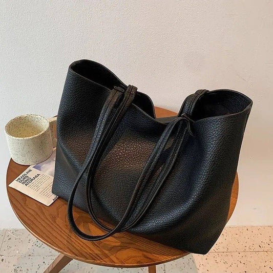 Minimalist black pebbled leather tote bag