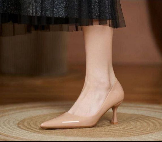 Nude or beige patent leather kitten heel pumps