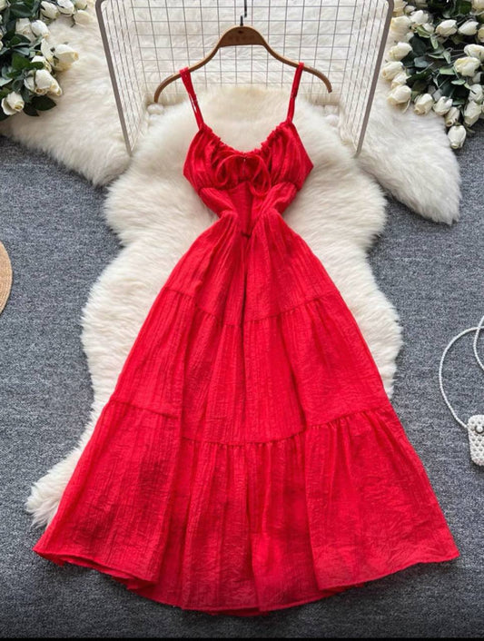 Red tiered maxi dress with spaghetti straps and a ruffled, ruched bodice