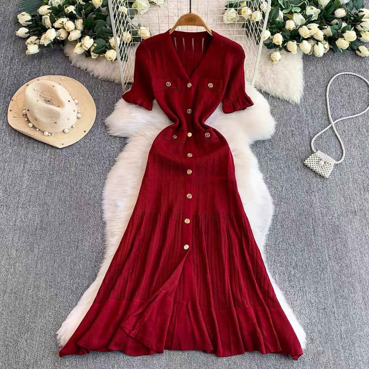 Burgundy short sleeve knit maxi dress features an elegant V neck and a row of front buttons