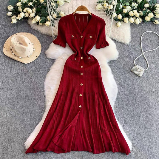 Burgundy short sleeve knit maxi dress features an elegant V neck and a row of front buttons