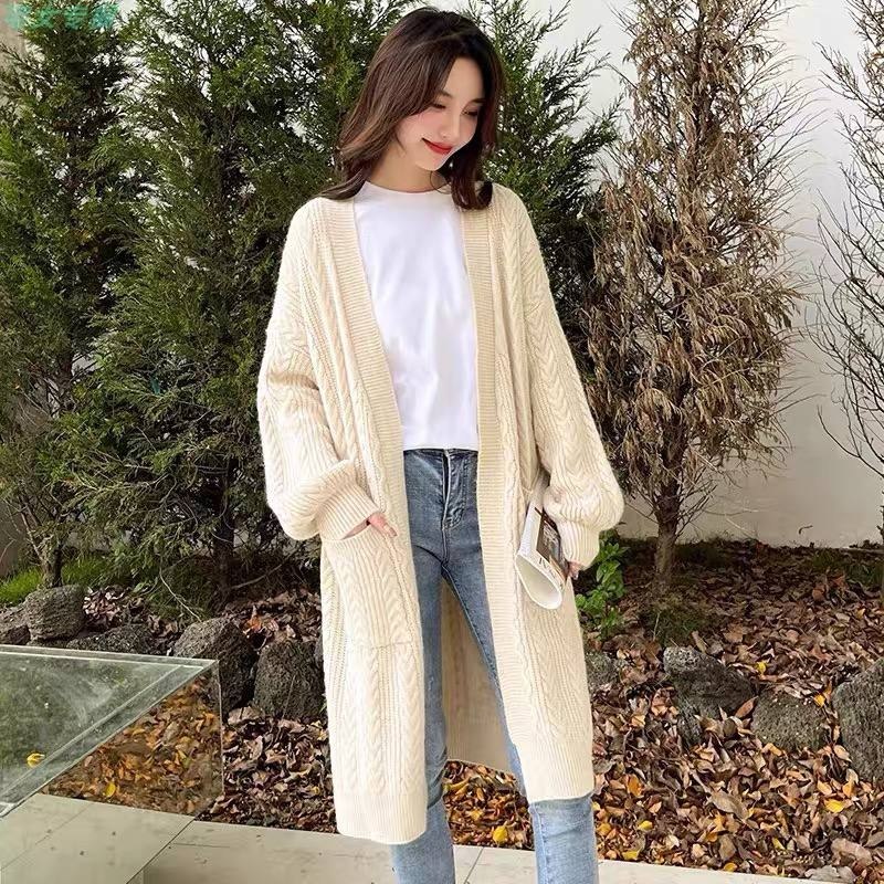 Long white cable-knit cardigan