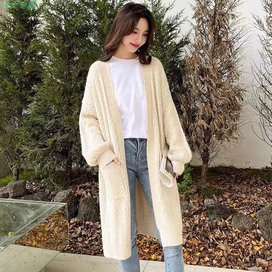 Long white cable-knit cardigan