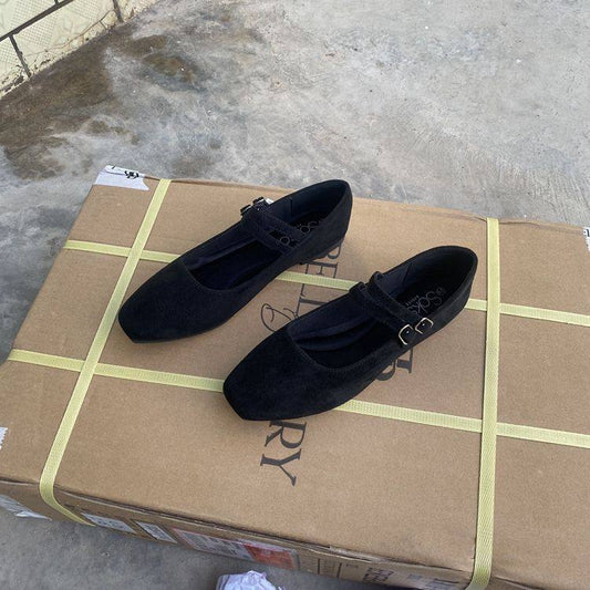 Black suede Mary Jane flats