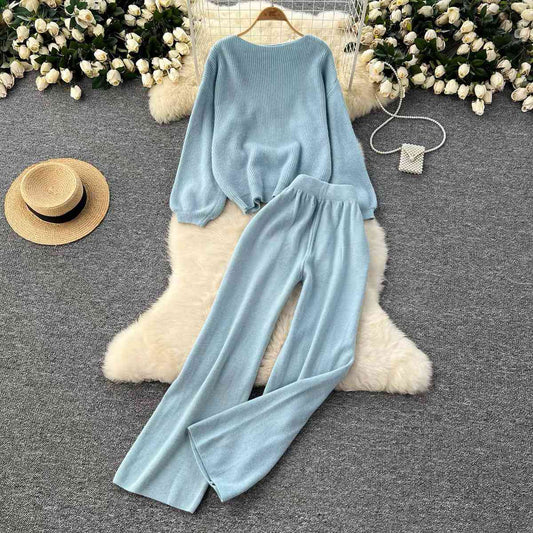 Light blue rib-knit two-piece lounge set featuring a relaxed long-sleeve pullover sweater and matching high-waist wide-leg pants