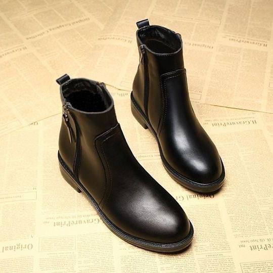 Minimalist black leather ankle boots