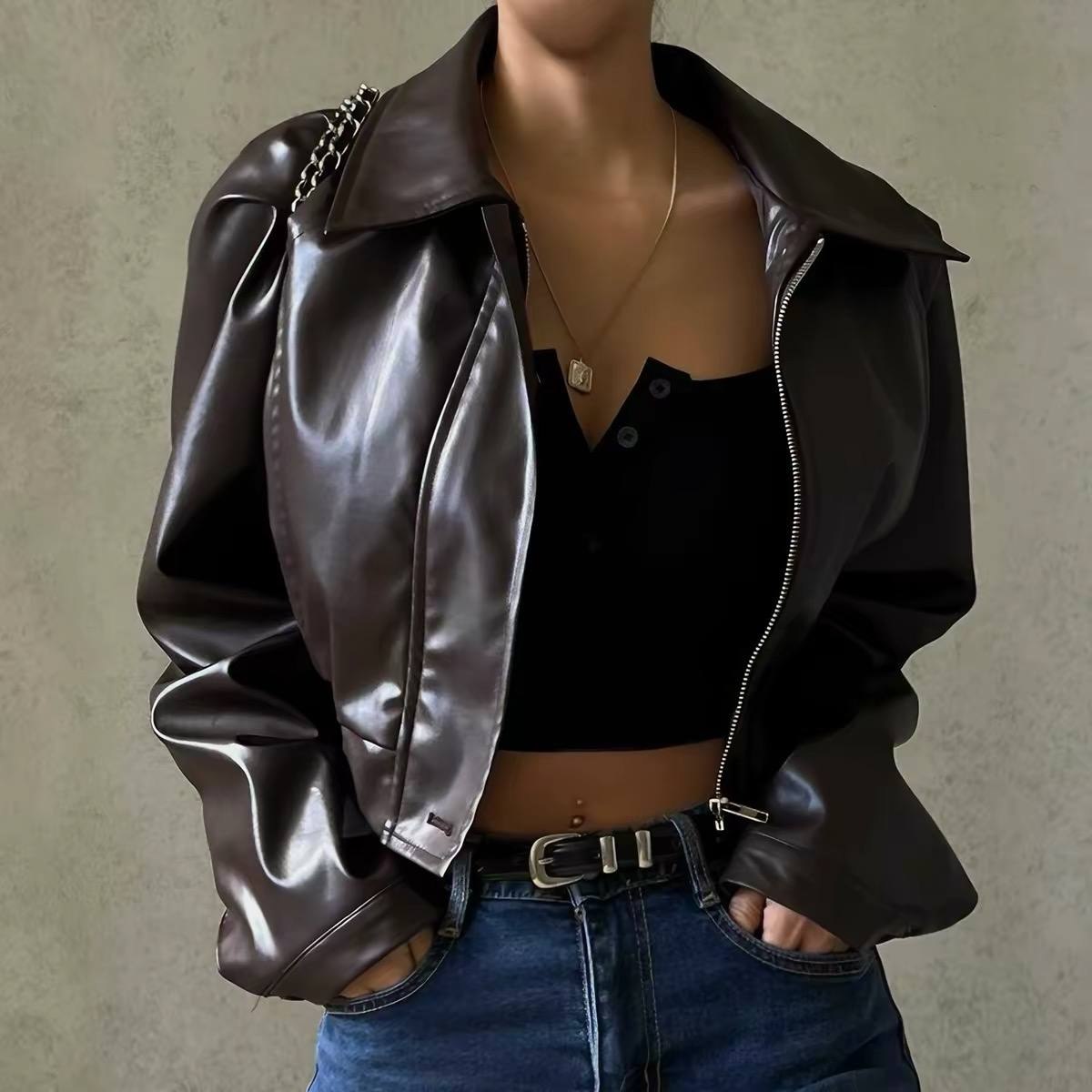 Woman wearing a dark brown cropped faux leather jacket