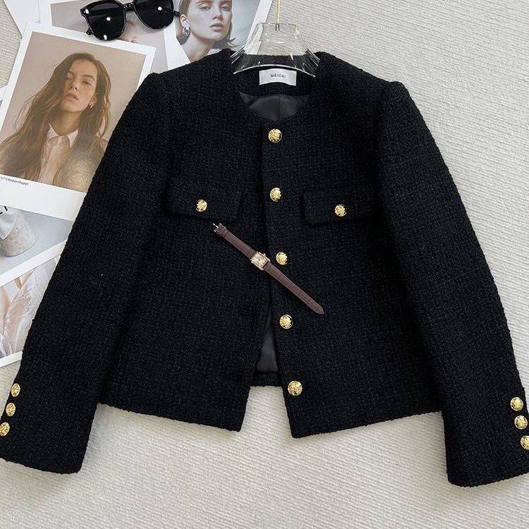 Black tweed jacket features a classic coat