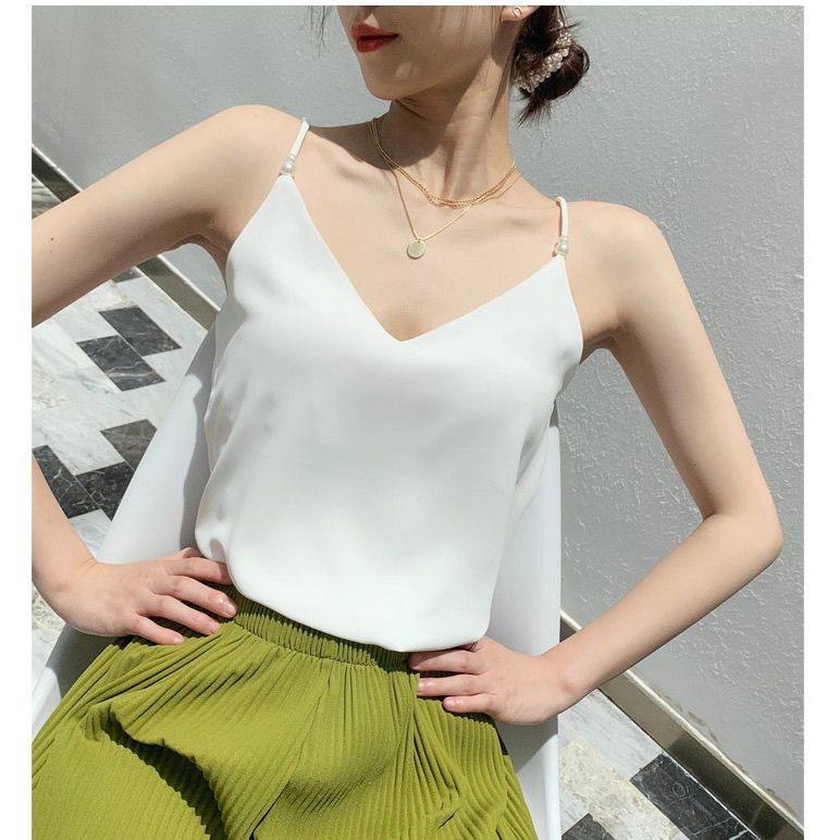 Chic white camisole is a versatile wardrobe staple